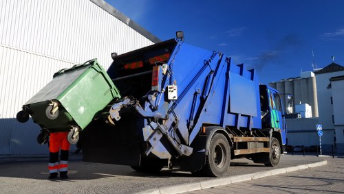 Local garbage collection team handling residential waste in Rubbish Junk