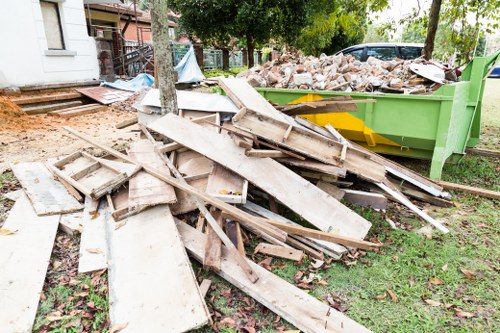 Local waste removal team collecting household rubbish in Rubbish Junk