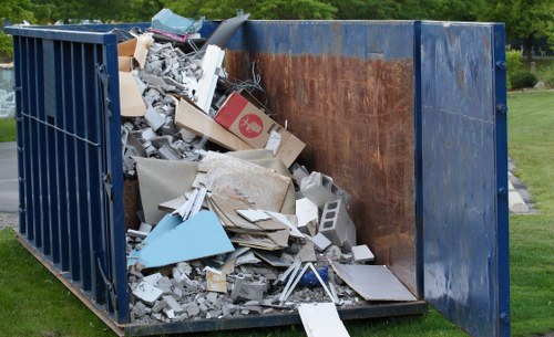 Local rubbish collection team handling bulky waste in a residential street