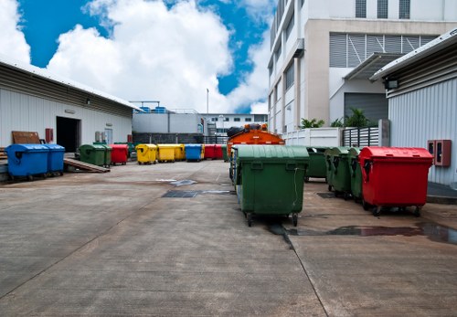 Workers removing mixed household waste during a local clearance job