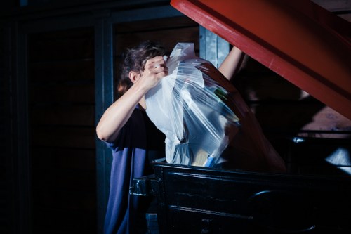 Bulky furniture and rubbish being loaded for waste clearance
