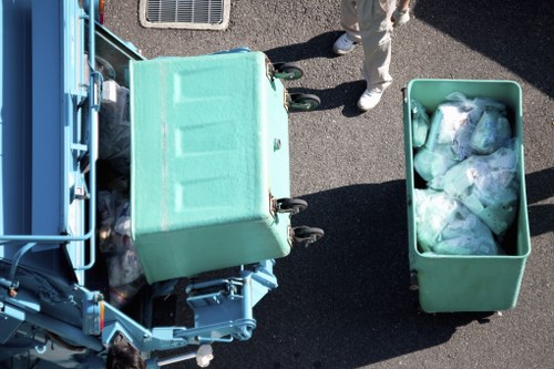 Rubbish removal team handling bulky household waste in a local area