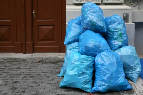 Local rubbish removal team handling commercial fridge disposal