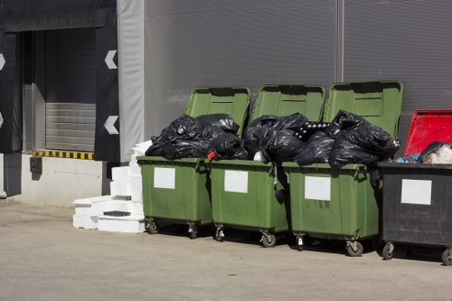 Professional crew handling bulky furniture and mixed waste
